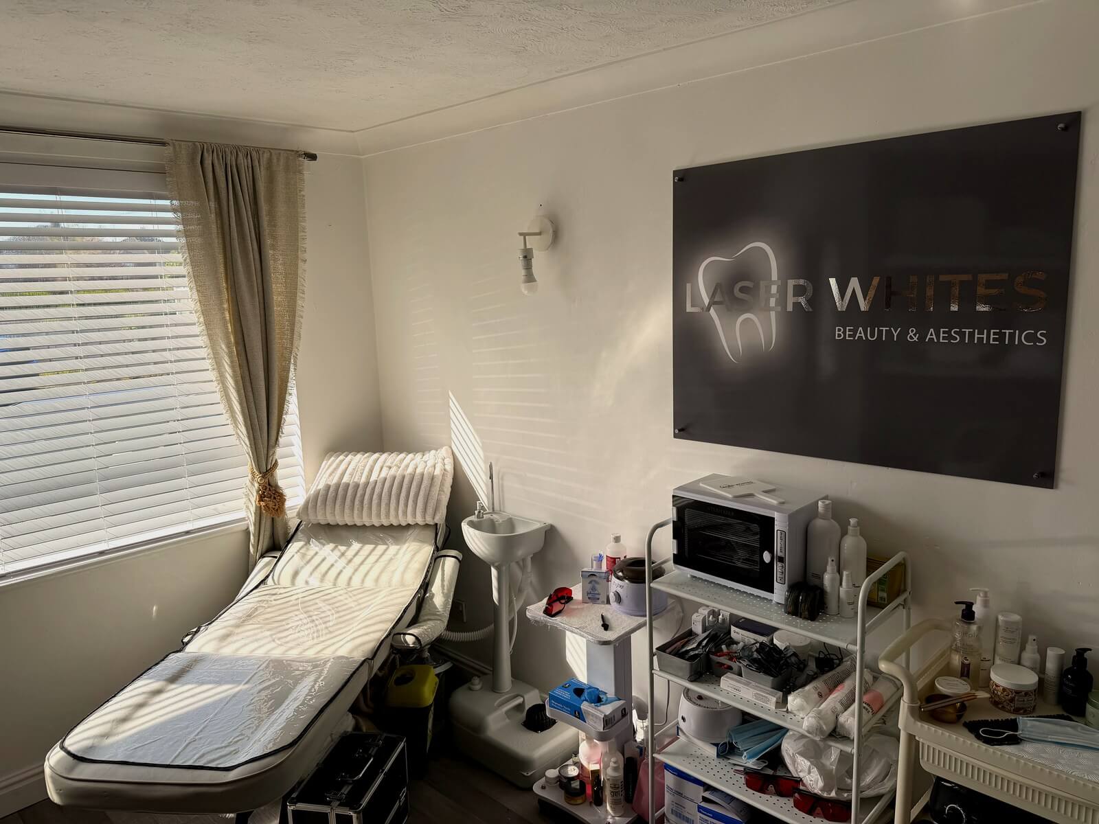 Laser Whites branded sign in treatment room
